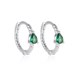 Detailed view of silver twist rope hoop earrings featuring pear cut emerald green stones