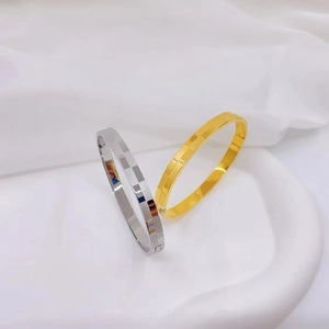 Gold and silver checkerboard pattern titanium steel bangles with geometric matte finish