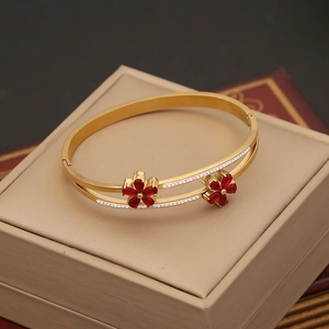 Gold double-layered stainless steel open bangle featuring red zircon flowers