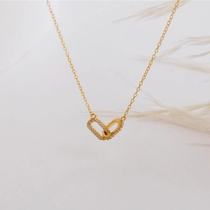 Minimalist double interlocking oval necklace with gold plating and sparkling zircon accents