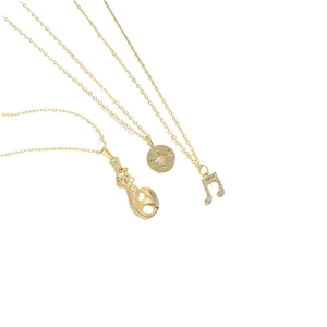 Golden musical note, mermaid and star pendant necklaces set on white background