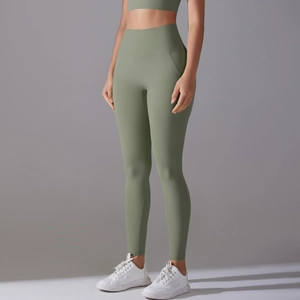 Detailed view of high-waisted sage green yoga leggings with seamless athletic fit