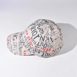 Detail of street graffiti pattern in red and black on a beige canvas baseball cap
