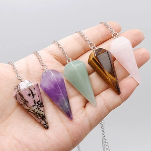 Detail showing five assorted hexagonal crystal pendants in rose quartz and amethyst