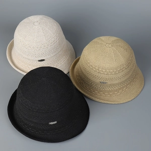 Detailed close-up showing textured knit patterns of breathable hollow straw sun hats