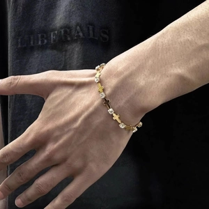 Men's adjustable gold titanium steel cross bracelet with cubic zirconia inlay details