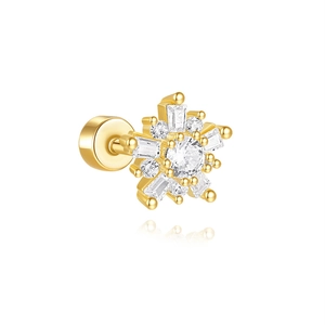 Macro shot of s925 silver gold-plated star piercing stud with zircon snowflake design