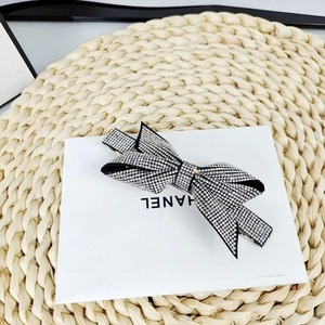 Macro shot of an elegant bow hair clip fully encrusted with shimmering silver rhinestones