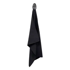 Detail of waffle-weave microfiber golf towel with black leather hanging loop and magnetic snap