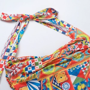 Detailed macro view of colorful Mediterranean print fabric and halter neck tie strings