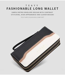 Detail view of tri-color patchwork leather wallet with double zipper and wrist strap