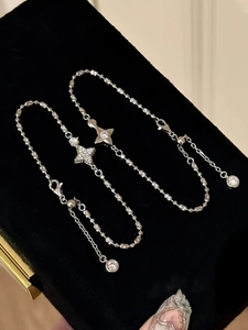 Detail of adjustable double-layer bracelet with sparkling zircon star charms