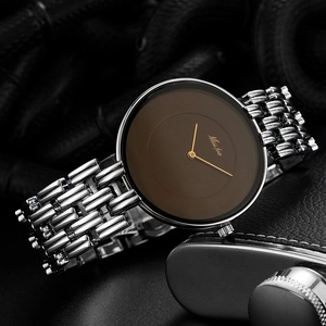 Detail of silver link bracelet watch with minimalist brown dial and Miss Fox logo