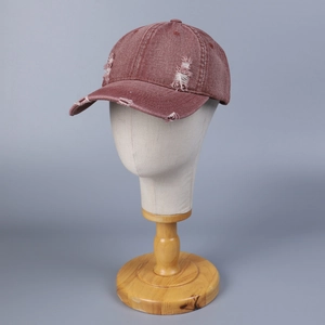 Vintage washed denim baseball cap in rose red with distressed rip details for street style