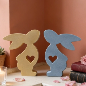 Minimalist rabbit ceramic ornaments with heart cutout and matte finish in a cozy home setting