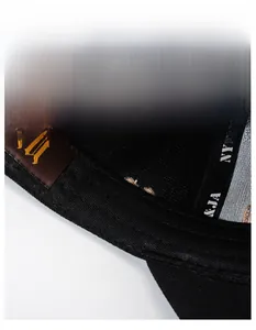 Macro detail of breathable widened sweatband and brand tag inside the baseball cap