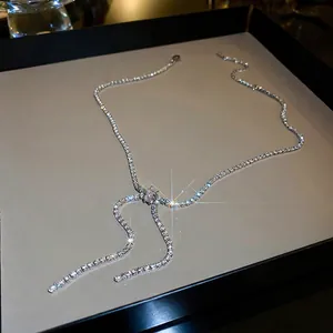 Sparkling silver bow knot Y-necklace with cubic zirconia tassels in a luxury style