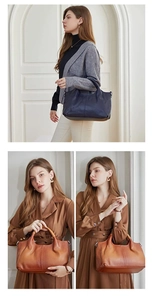 Fashionable large PU leather tote bag shown in navy blue and brown on a female model