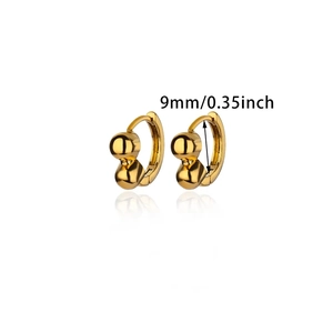 Detailed view of 9mm gold hoop earrings with double bead accents and mirror reflection