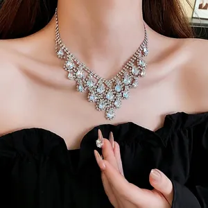 Elegant V-shaped silver fringe necklace with sparkling rhinestones and pear-cut gemstones