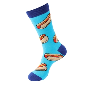 Detail of light blue crew socks featuring colorful cartoon hot dog prints and navy accents