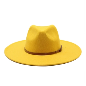 Close-up of a yellow wool fedora hat with a brown leather belt and metal buckle details