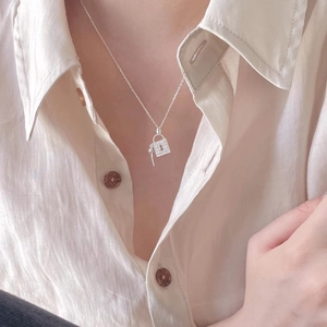 Elegant 925 sterling silver padlock and key pendant necklace with sparkling zircon accents