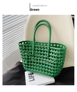 Close-up of green woven jelly bag with hollow grid texture and glossy finish