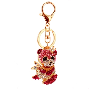 Portachiavi creativo con panda decorato con strass rosa e bianchi su metallo dorato