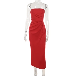 Detail view of red satin strapless dress with elegant side pleats and silk texture