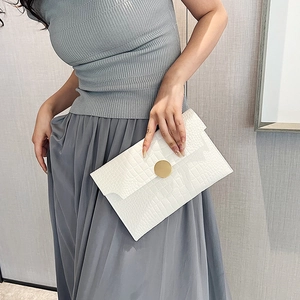 Elegant white envelope clutch bag with crocodile texture and gold circular buckle lock