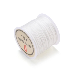Detailed macro view of 0.8mm high-quality white jade thread for handmade jewelry DIY projects
