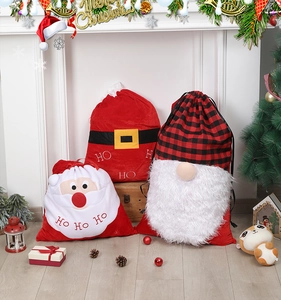 Three oversized Christmas gnome drawstring gift bags in a festive indoor scene with tree