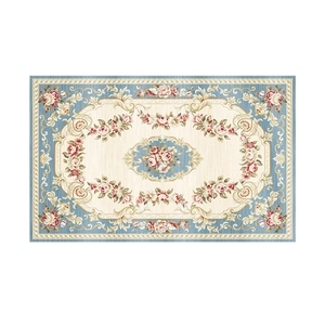 Absorbent non-slip bathroom mat featuring blue European floral rose patterns on white background