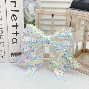Iridescent aurora Christmas bow decoration with holographic sequins for festive event decor