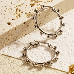 Minimalist silver hoop earrings with small metal beads made of polished stainless steel