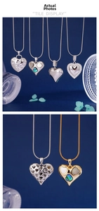 Detailed close-up of heart pendants with shell inlay and crystal border on snake chains
