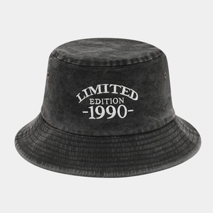 Detail of embroidered Limited Edition 1990 text on washed black cotton bucket hat