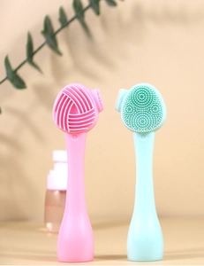 Dual-sided silicone facial cleansing brush with fine bristles and massage points