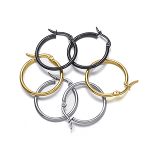 Three pairs of classic round hoop earrings in black, gold, and silver stainless steel