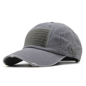 Close-up of distressed grey baseball cap with USA embroidery and vintage washed texture