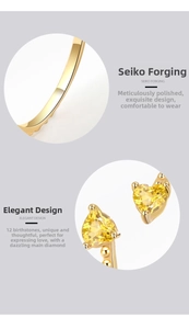 Close-up of heart-shaped yellow zircon ring with precision claw setting and gold finish