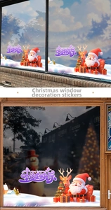 Detail of Christmas window decals with Santa Claus, reindeer, and tree on glass panels