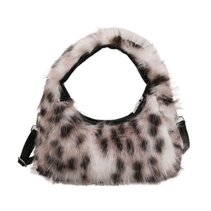 Fashionable plush crescent handbag with black and white animal print and shoulder strap