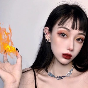 Punk hip hop flame pattern necklace and silver metal jewelry set worn by a model