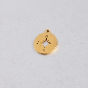 Polished gold compass pendant with hollow star and engraved direction letters NSEW