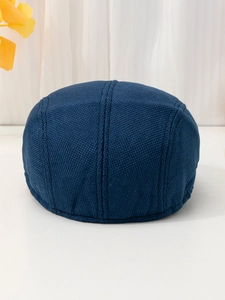 Macro detail of breathable dark blue linen texture on the back of this flat ivy cap