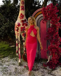 Detail of the backless halter design and floral trim on this rose red bodycon dress