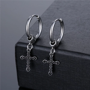 Vintage silver stainless steel cross hoop earrings for men on a black textured box