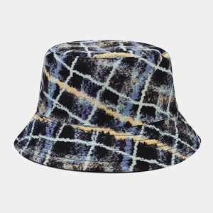 Close-up of double-sided bucket hat with blue and yellow graffiti plaid canvas pattern